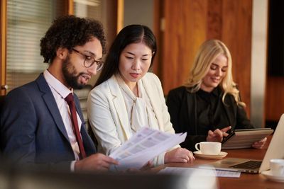 Lawyers reviewing documents in a meeting room